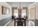 Traditional dining room bathed in sunlight showcases hardwood floors and classic trim at 2094 Green Gate Pl, Grayson, GA 30017