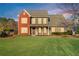 Charming two-story home featuring a well-manicured lawn and brick/siding facade at 2094 Green Gate Pl, Grayson, GA 30017