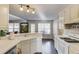 Bright kitchen with white cabinetry, stainless steel appliances, and an adjacent dining area at 2094 Green Gate Pl, Grayson, GA 30017