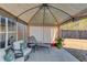 Back patio sitting area with white lounge chair and pergola at 2094 Green Gate Pl, Grayson, GA 30017