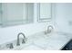 Bathroom featuring double sinks, white marble countertop, and modern faucets at 2493 Swallow Cir, Atlanta, GA 30315