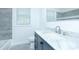 Bathroom featuring tub, toilet, and vanity with marble countertop at 2493 Swallow Cir, Atlanta, GA 30315