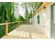 Well-lit wooden deck with modern railings and outdoor view at 2493 Swallow Cir, Atlanta, GA 30315