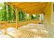 Expansive wooden deck with covered area overlooks lush greenery at 2493 Swallow Cir, Atlanta, GA 30315