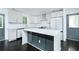 Modern kitchen showcases an island, white countertops, and stainless steel appliances at 2493 Swallow Cir, Atlanta, GA 30315