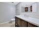 Bathroom with dark wood vanity, white countertops, and neutral walls at 413 Northdale Ct, Lawrenceville, GA 30046