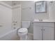 Clean bathroom featuring a tub/shower combination, toilet, and a vanity sink at 413 Northdale Ct, Lawrenceville, GA 30046