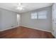 A well-lit bedroom with wood floors, neutral walls, and a ceiling fan at 413 Northdale Ct, Lawrenceville, GA 30046