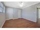 Inviting bedroom featuring two closets, hardwood floors, a ceiling fan, and neutral paint at 413 Northdale Ct, Lawrenceville, GA 30046