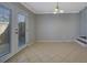 Dining area with tile flooring, double doors, and ample natural light at 413 Northdale Ct, Lawrenceville, GA 30046