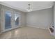 Dining area with tile flooring, double doors, and chandelier lighting at 413 Northdale Ct, Lawrenceville, GA 30046