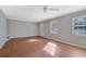 Inviting living room with hardwood floors, neutral walls, and bright windows at 413 Northdale Ct, Lawrenceville, GA 30046