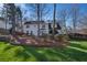 Expansive backyard with mature trees and a well-maintained lawn, offering privacy and tranquility at 4172 Westchester Ne Xing, Roswell, GA 30075