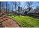 A lush green lawn and manicured landscaping enhance the appeal of this spacious backyard at 4172 Westchester Ne Xing, Roswell, GA 30075