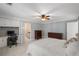 Bedroom featuring a built-in desk and cabinets, a bed, and soft neutral colors at 4172 Westchester Ne Xing, Roswell, GA 30075