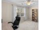 Bedroom space featuring a desk, chair, book shelf, window with natural light, and neutral carpet at 4172 Westchester Ne Xing, Roswell, GA 30075