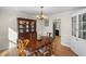 Traditional dining room featuring hardwood floors, chandelier, and a china cabinet at 4172 Westchester Ne Xing, Roswell, GA 30075