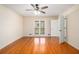 Bedroom with hardwood flooring, ceiling fan and neutral walls, providing a comfortable living space at 459 Rabbit Run, Mcdonough, GA 30252