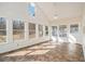 Bright sunroom with many windows providing natural light and scenic views, ideal for relaxation at 459 Rabbit Run, Mcdonough, GA 30252