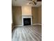 Cozy living room with hardwood floors and a fireplace at 7597 Cole Ln, Atlanta, GA 30349