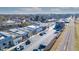 Aerial view of downtown area featuring colorful buildings, parking lots, and railroad tracks at 1141 Milstead Ne Ave, Conyers, GA 30012