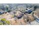 Aerial view of a home with a large yard and surrounding bare trees at 1141 Milstead Ne Ave, Conyers, GA 30012