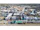 Aerial view of a historic downtown area with colorful buildings, parked cars, and railroad tracks at 1141 Milstead Ne Ave, Conyers, GA 30012