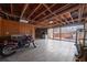 Spacious basement features an unfinished ceiling, wood paneling, and sliding glass doors to the exterior at 1141 Milstead Ne Ave, Conyers, GA 30012