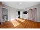 Bedroom with wooden floors and natural light seeping through the windows at 1141 Milstead Ne Ave, Conyers, GA 30012