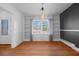 Dining room featuring hardwood floors, window, and built-in shelving at 1141 Milstead Ne Ave, Conyers, GA 30012