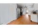 Kitchen area with stainless steel appliances, wooden floors and light blue walls at 1141 Milstead Ne Ave, Conyers, GA 30012