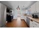 Kitchen area with stainless steel appliances and traditional white cabinetry at 1141 Milstead Ne Ave, Conyers, GA 30012