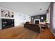 Staged living room with fireplace, hardwood floors, and modern furnishings at 1141 Milstead Ne Ave, Conyers, GA 30012