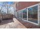 Outdoor patio area featuring brick tiling and a large sliding glass doors to the home's interior at 1141 Milstead Ne Ave, Conyers, GA 30012