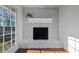 Sunroom featuring fireplace with a mantel, and windows that provide natural light at 1141 Milstead Ne Ave, Conyers, GA 30012