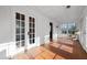 Sunroom with red tile floor, with windows and double glass pane doors at 1141 Milstead Ne Ave, Conyers, GA 30012