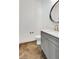 Modern powder room featuring stylish vanity, mirror, and fixtures at 244 Locust Ne St # B, Atlanta, GA 30317