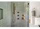 Detail of glass-enclosed shower with multiple showerheads and gold hardware at 244 Locust Ne St # B, Atlanta, GA 30317