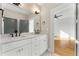 Light and bright bathroom featuring marble countertops, gold hardware, and modern design at 244 Locust Ne St # B, Atlanta, GA 30317