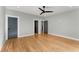 Large bedroom features a ceiling fan and hardwood flooring at 244 Locust Ne St # B, Atlanta, GA 30317