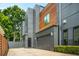 Modern two-story home featuring mixed siding, an attached garage, and a well-maintained lawn at 244 Locust Ne St # B, Atlanta, GA 30317