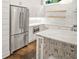 Beautiful kitchen featuring an island, stainless steel refrigerator, and white backsplash at 244 Locust Ne St # B, Atlanta, GA 30317