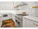 Bright kitchen featuring white cabinets, stainless steel appliances, and stylish hardware at 244 Locust Ne St # B, Atlanta, GA 30317