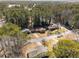 An aerial view of a home nestled among mature trees in a serene neighborhood setting at 3001 W Potomac Dr, Atlanta, GA 30344