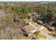 Aerial view showcases the neighborhood and the property's positioning within a wooded area at 3001 W Potomac Dr, Atlanta, GA 30344