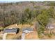 Aerial view highlighting the houses nestled among mature trees in a peaceful residential area at 3001 W Potomac Dr, Atlanta, GA 30344