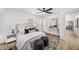 Bright bedroom featuring a desk, ceiling fan, natural light, and a modern animal print rug at 3001 W Potomac Dr, Atlanta, GA 30344