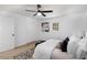 Bright bedroom featuring a ceiling fan, closet, natural light, and a modern animal print rug at 3001 W Potomac Dr, Atlanta, GA 30344