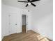 Bedroom with wood floors, ceiling fan, and an open doorway at 3001 W Potomac Dr, Atlanta, GA 30344