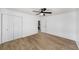 Bright, airy bedroom with wood floors, closet, and a ceiling fan at 3001 W Potomac Dr, Atlanta, GA 30344